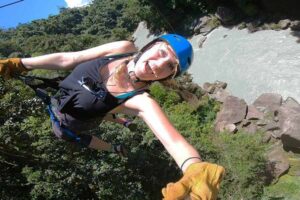 Guest on a canopy tour with Rios Lodge zipping over the Pacuare River